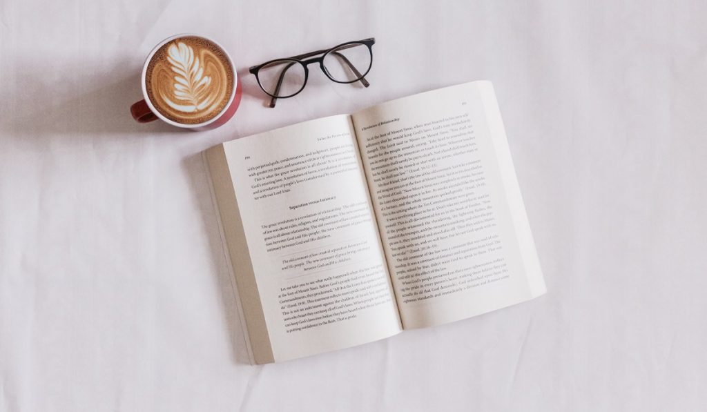Photo of a book and reading glasses